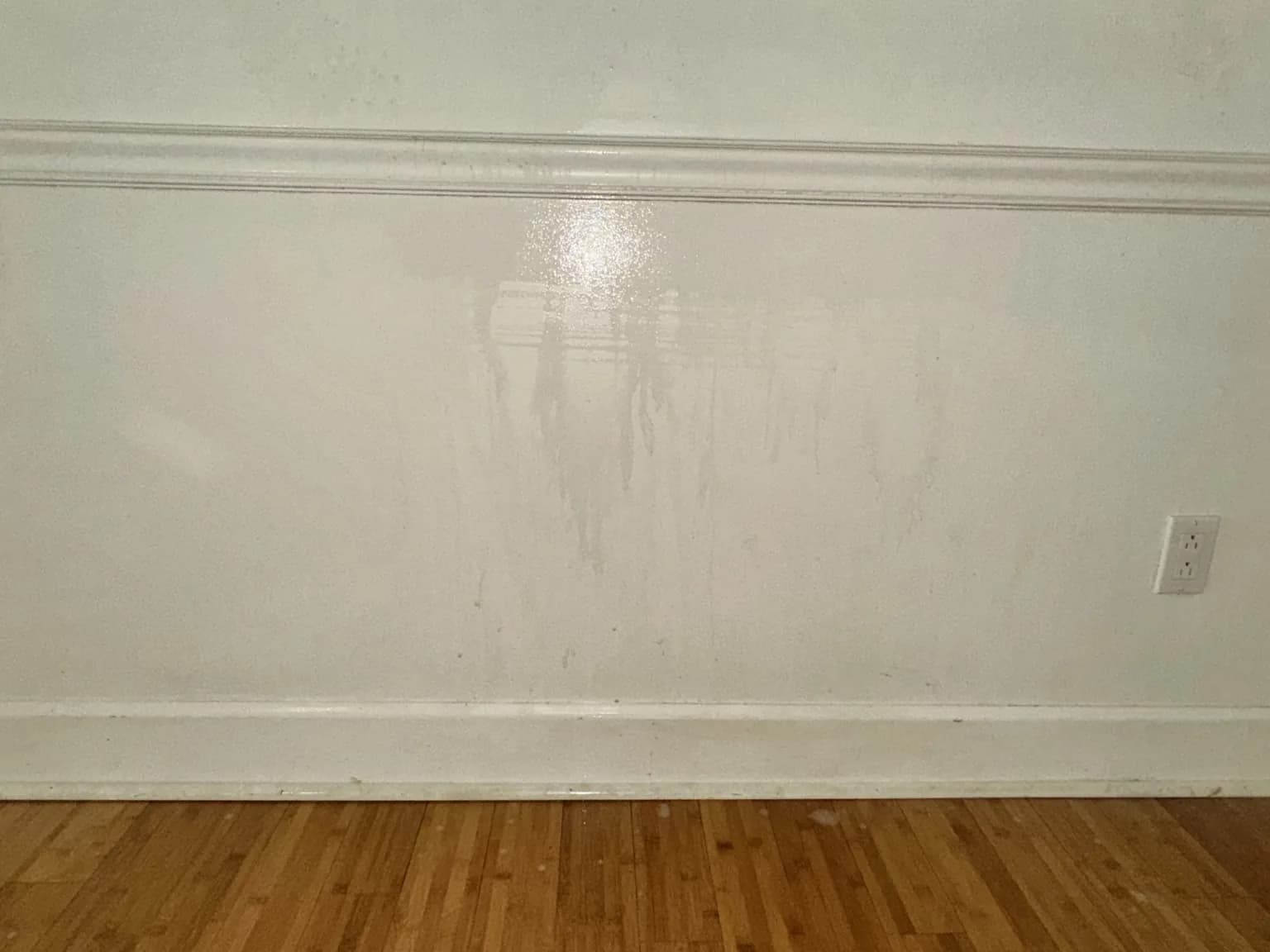 Tobacco-stained wall being washed with a visible clean section