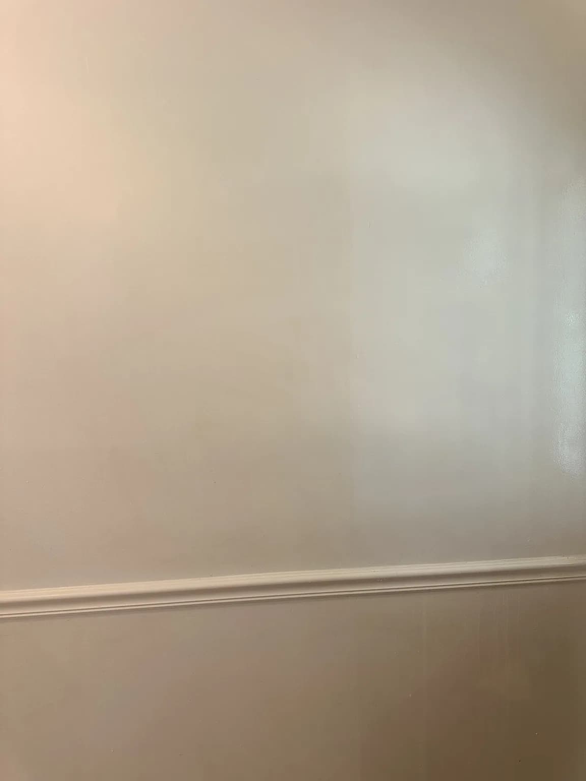 Wall with a clean washed section during tobacco residue removal
