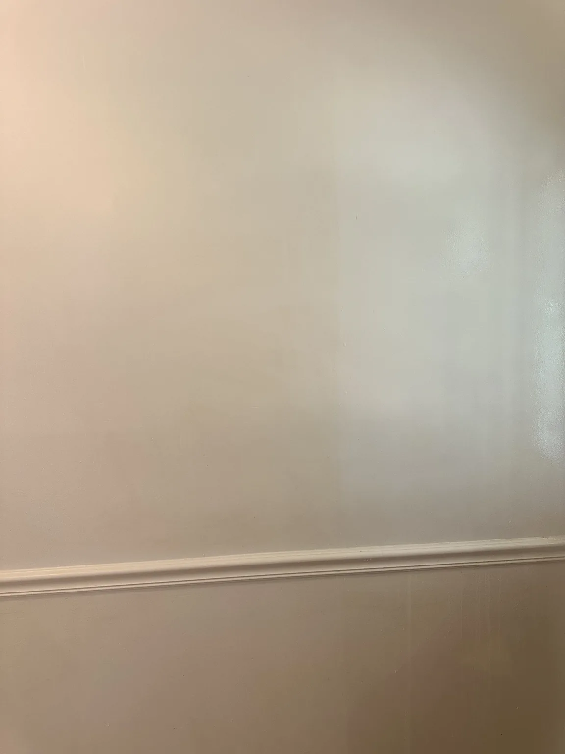 Wall with a clean washed section during tobacco residue removal